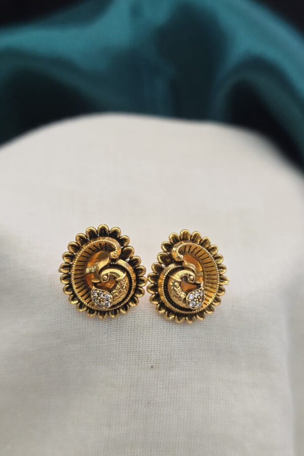 Antique stud with white stone